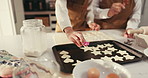 Baking, shape and people in kitchen with cookie cutter to prepare dessert, biscuits and stars. Family, ingredients and hands of grandmother with child for teaching, bonding or learning recipe in home