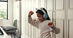 Child, dancing and girl in kitchen, headphones and energy with happiness, audio and radio. Home, dancer or coordination with headset, movement or album playlist with subscription for song or hip hop