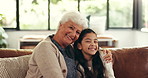 Face, embrace and grandmother on sofa, girl and bonding together with happiness. Family, grandparent and senior woman on couch, child and smile with love, home and relationship with care and laughing