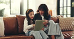 Tablet, conversation and mother with child on sofa for elearning, education or online game. Happy, bonding and mom with girl kid on technology for gaming website together in living room in home.