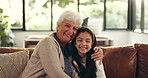 Face, embrace and grandmother on couch, girl and bonding together with happiness. Family, grandparent and senior woman on sofa, child and smile with love, home and relationship with care and kid