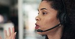 Woman, headset and discussion at call center for legal aid, consulting and advisory services at office. Person, agent and talk with voip mic, solution and problem solving with contact at law firm
