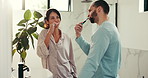 Brushing teeth, oral hygiene and happy couple in bathroom, fresh breath and cleaning mouth. Home, morning routine and man with woman, dental health and remove plaque with wellness and benefits