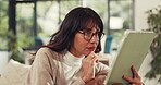 Woman, remote work and reading on tablet at house for research, review article and editing draft. Journalist, thinking and digital for proofreading, story headline and editor feedback for publication