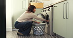 Woman, washing machine and basket in home with clothes for laundry, housekeeping or chores. Female person, fabric hygiene and appliance with routine in house with morning, fresh linen and task