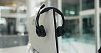 Empty, office and headset on monitor in call center for lead generation, online sales and crm. Business, equipment and mic on computer for customer service, virtual support and contact in workplace