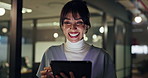 Business, woman and tablet in office at night for research, reading article and funny feedback. Smile, journalist and laughing with digital for comedy story, news headline and deadline of publication