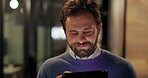 Walking, night and business man on tablet for research, project review and online proposal. Professional, working late and person on tech for reading feedback, digital report and website in office