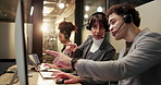 Collaboration, computer and help with business people in call center for late night assistance. Conversation, pointing and support with employee team in customer service office for evening feedback