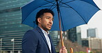 City, walking and businessman nervous with umbrella for travel, morning commute and journey to work. Lawyer, attorney and person with weather anxiety in urban town for trip with metro and opportunity