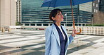 City, walking and business woman with umbrella for travel, morning commute and journey to work. Lawyer, attorney and person with weather in urban town for trip with smile, metro and opportunity