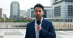Man, face and anchor with mic in city for broadcast, breaking news or mass media reporter. Portrait, male person or presenter with announcement for POV, global headline or live story in an urban town