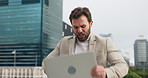 Angry, businessman or laptop with destruction in city for vandalism or aggression in sequence. Frustrated man, employee or breaking computer on floor for debt, error or anger problem in an urban town