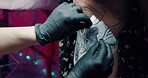 Tattoo, tracing and people in parlour with paper, mental benefits or individuality in body art. Cosmetic, design and artist in studio with gloves, stress reduction or endorphin boost in ink culture

