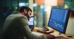 Frustrated man, night and stock market with computer screen for fail, bad investment or decrease. Businessman, broker or working late with technology display, graph or chart for trading in workplace