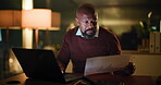 Business, man and laptop with documents at night for financial report, data analysis and deadline. Finance manager, mature black person and tech with graphs for revenue stats, forecasting or overtime