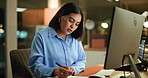 Writing, notebook and computer with business woman in office for night, audit results and economy revenue. Tax deadline, account manager and digital report with person in agency for budget review