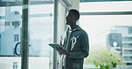 Tablet, thinking and window with business black man in office for management, planning or research. Administration, app and vision with African employee in professional workplace for report or review