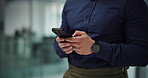 Hands, phone and text message with employee man in office for communication or connection. App, mobile and typing with professional business person in workplace for online chat, planning or research