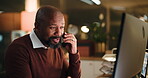 Computer, black man and night in office with phone call, accountant or financial manager with advice. Mature, business person and bookkeeping with tech, overtime research and administration agency