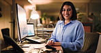 Woman, face and happy at night, office and computer with charts, pride and confident with accounting. Person, smile and accountant with review, portrait or dark workplace at finance agency in Mexico