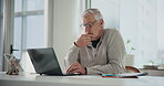 Laptop, reading and thinking with business man at desk in office for planning, report or research. Computer, concentration and typing with mature employee in for administration or management