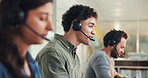 Business, call center and man with conversation, help desk or communication with tech support. People, consulting or employees with discussion, headset or customer service with feedback or contact us