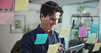Scroll, glass wall and man with planning for tablet, project management or solution in office. Creative agency, sticky note and worker with mind map for business strategy, ideas or brainstorming