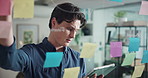 Writing, glass wall and man with sticky note for tablet, project management or solution in office. Creative agency, thinking and worker with mind map for business strategy, ideas or brainstorming