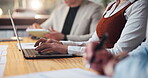 Hands, laptop and notes with business people in boardroom for meeting or upskill workshop. Computer, seminar and typing with employee team at table in office together for development or training