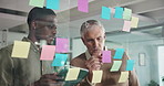 Sticky note, ideas and business men in office with collaboration for finance budget. Glass wall, writing and manager with financial advisor for planning on corporate investment proposal in workplace.