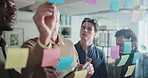 Sticky note, discussion and business men in office with collaboration for finance budget. Glass wall, writing and manager with financial advisors for ideas on investment proposal in workplace.