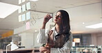 Business woman, writing and glass for planning with sticky note, mind map or thinking for project agenda. Employee, link ideas or schedule with research insight, info or details on board at night
