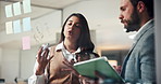 Business, teamwork and advice at glass wall with tablet, marketing or planning ideas in office. Project management, man and woman with solution, digital app or collaboration for research strategy
