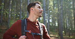 Thinking, hiking and man in woods, nature and explore with vacation, environment and travel. Outdoor, hiker and happy person in forest, tourism and trekking with wonder, sightseeing and contemplation
