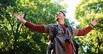 Happy man, trees and freedom with backpack for hiking journey or outdoor adventure in nature. Male person, hiker or smile with bag for fresh air, wilderness or exploration in jungle, woods or forest