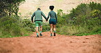 Fitness, holding hands and back of couple with hiking in nature for bonding, exercise or adventure. Health, love and man with woman for outdoor trekking with cardio workout or wellness in morning.