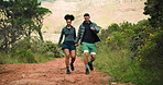 Fitness, holding hands and couple with hike in nature for bonding, exercise or adventure together. Health, mountain and man with woman for outdoor trekking with cardio workout or wellness in morning.