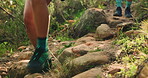 Legs, hiking and fitness with couple in nature for walking, travel adventure and health journey. Explore, environment and tourist with shoes of people on stone path for steps, vacation and trekking