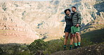 Hiking, pointing and couple with support, exercise and travel with journey, break and challenge. View, hiker and man with woman, wellness or countryside with embrace and bonding together in Indonesia