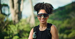 Face, happy woman and sunglasses with hiking in forest, nature park or environment for trekking with smile. Female hiker, fresh air and travel with shades and tourist laughing in woods for exercise