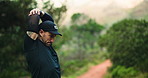Man, trail runner and stretching in forest for warm up, exercise and ready for marathon training. Person, athlete and fitness routine with preparation for workout, outdoor and nature in New Zealand