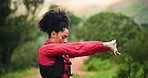 Woman, exercise and stretching arms in nature, fitness or ready for run or hiking in woods. Athlete, warm up and muscle prep before workout, cardio and space in forest to start trekking challenge