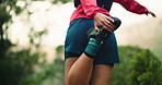 Legs, fitness and person stretching in nature, exercise prep or ready for run in woods. Back of athlete, warm up and muscle relief before workout, cardio and space in forest to start sport challenge