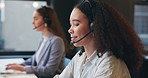 Headset, smile and typing with woman in call center for assistance, feedback or solution. Communication, computer and help with happy employee in coworking office for customer service or support