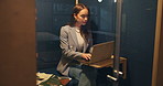 Online, employee and woman with laptop in booth, journalist or working late with project on website. Soundproof, cubicle and reporter with tech for deadline, privacy and creative at night for task