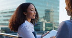 Business women, rooftop and conversation with meeting outdoor for planning or discussion. Building, city or real estate with client, developer and management for commercial investment on balcony