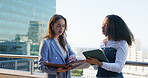 Business women, balcony and tablet with discussion outdoor for planning, deal or conversation. Building, city or real estate with client, developer and documents for commercial investment on rooftop