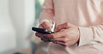 Home, hands and man with smartphone, typing and social media with digital app for communication. Apartment, internet and person with cellphone, scroll and network with online chatting and message