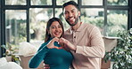Real estate, face and couple with heart hands in new home for moving in, mortgage success and gratitude. Love, people and support with emoji for property investment, security and thank you for house